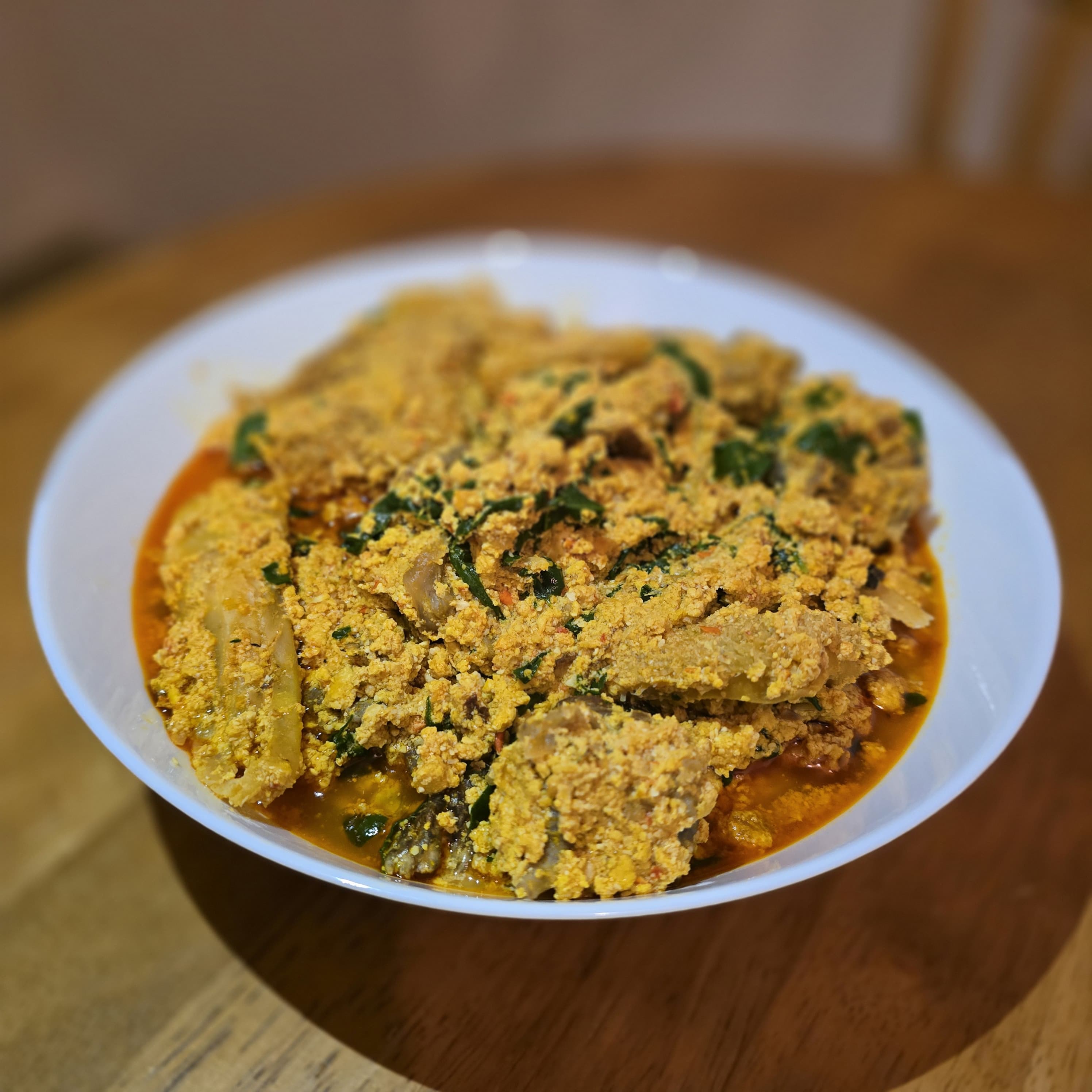 Authentic Egusi soup — rich, hearty West African melon soup in a bowl
