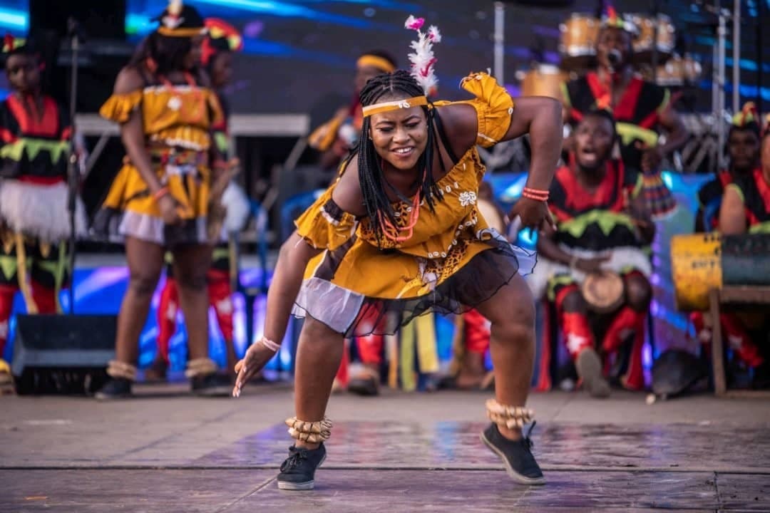 Igbo traditional dancer performing on stage in cultural costume